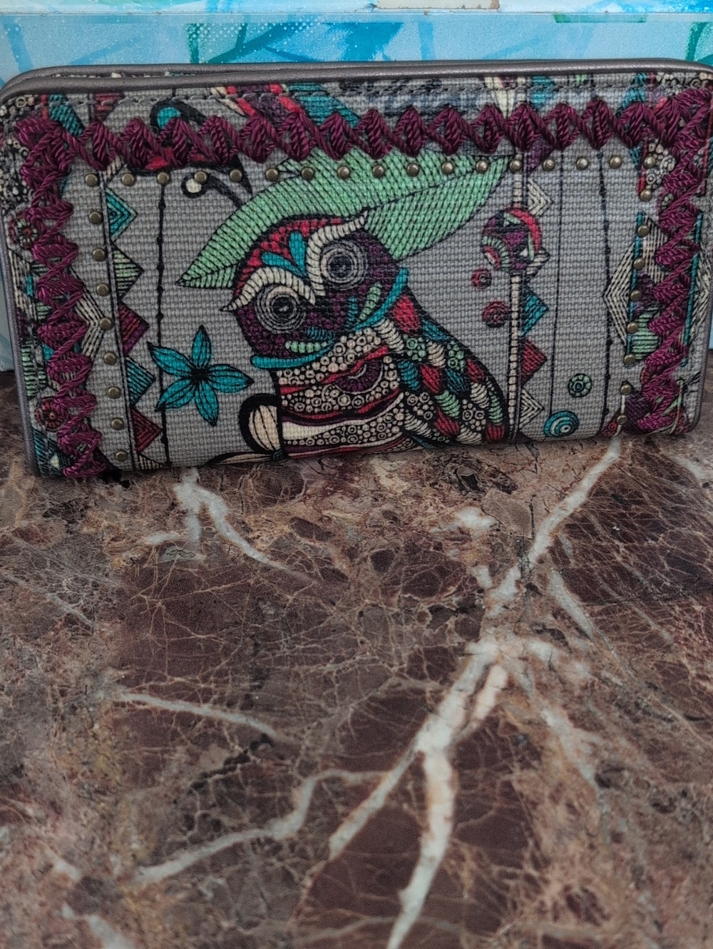 Sakroots Artist Circle foldable wallet in the "Charcoal Spirit Desert" owl print